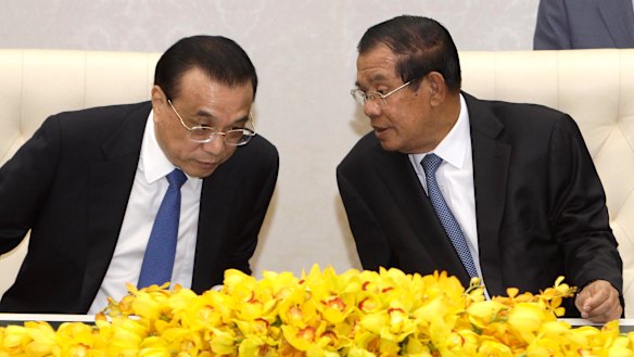Closer ties: China's Premier Li Keqiang, left, talks with his Cambodian counterpart Hun Sen, during a signing ceremony at Peace Palace in Phnom Penh, on January 11. 