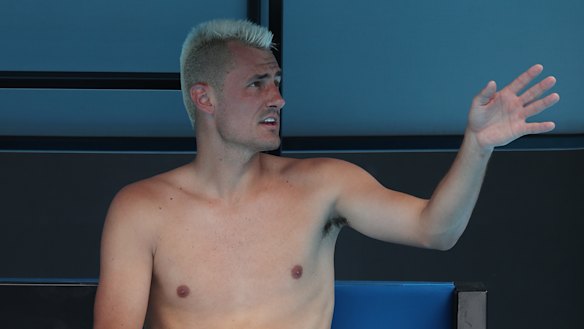 Bernard Tomic may not have a shirt, but he definitely has Covid.