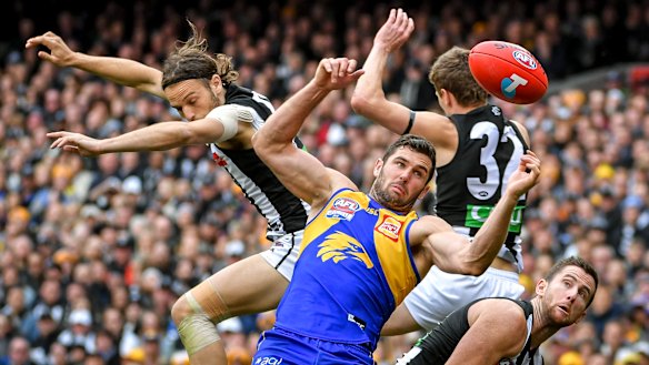 West Coast's Jack Darling battles a several Pies in the air.