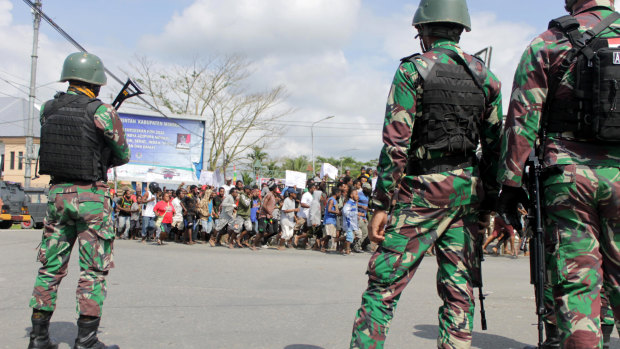 Indonesian soldiers stand guard during a protest in Timika, Papua province.
