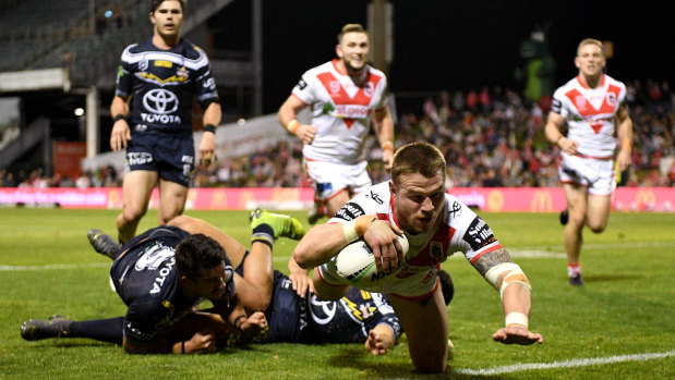 Touchdown: Euan Aitken scores during the Dragons' come-from-behind NRL win over North Queensland.