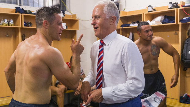 Meeting of the minds: Cooper Cronk discussing economic policy with Malcolm Turnbull. 