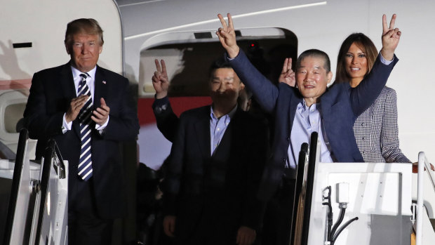 Donald Trump welcomes back three US prisoners released in May from detention in North Korea.