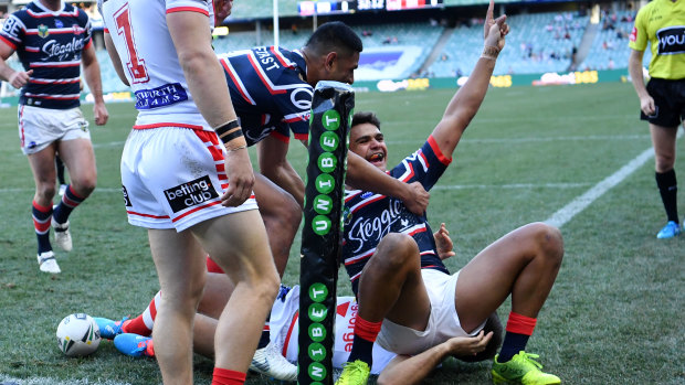 Unstoppable: Latrell Mitchell goes over again for the Roosters on another red-letter day for the Origin star.