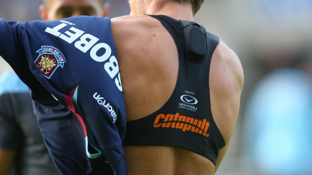 An athlete wears a Catapult heart monitor inside the  vest.