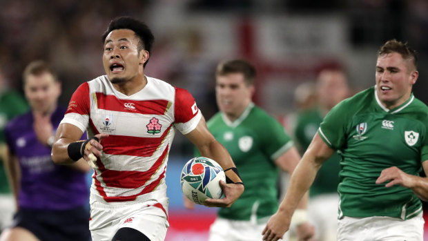 Heading for glory: Japan's Kenki Fukuoka streaks away against Ireland at Shizuoka Stadium Ecopa.