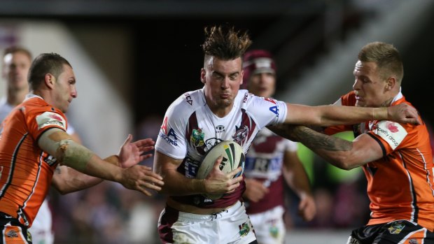 Old boy: Clint Gutherson takes the ball up for Manly in 2014.