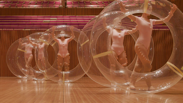 A scene from the film with doughnuts and dancers, inside the Concert Hall while it was under renovation.