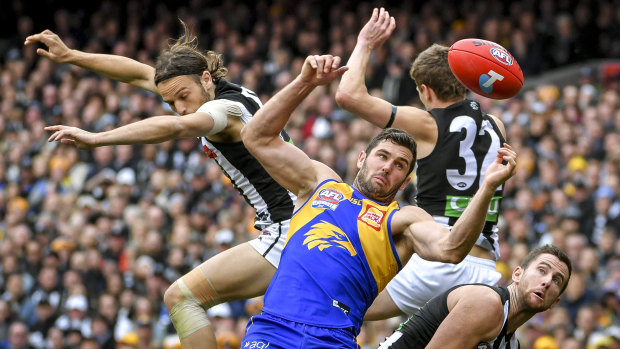 West Coast's Jack Darling battles a several Pies in the air.
