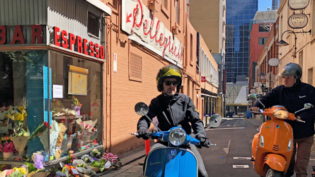 Members of the Vespa Club of Melbourne pay tribute to Pellegrinis Bar co-owner Sisto Malaspina, who was killed in the Bourke Street terror attack.