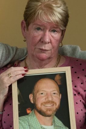 Joy Van Duinen holds a photo of her son Gary, who took his own life after a 13-hour gambling binge. 