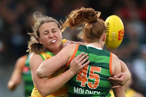 Australian Chelsea Biddell tackles Ireland’s Aishling Moloney.