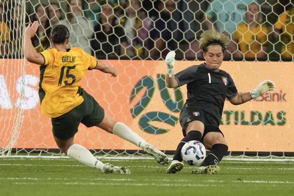 Taiwan’s goalkeeper Wang Yu-ting, right, blocks a shot at goal by Matilda Emily Gielnik.