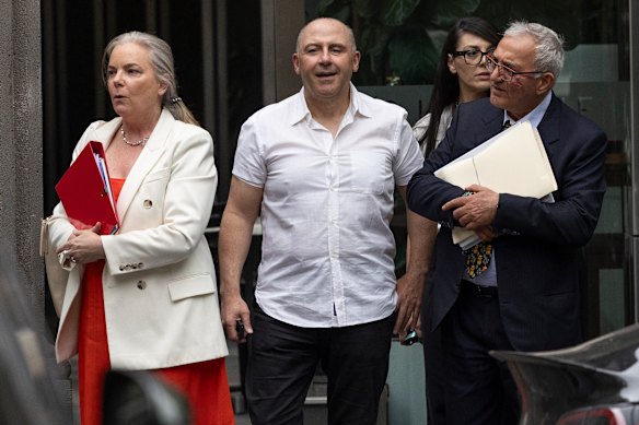 Tony Mokbel (centre) and his lawyers on Friday.