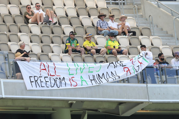 A pro-Palestine banner is removed by security in Perth