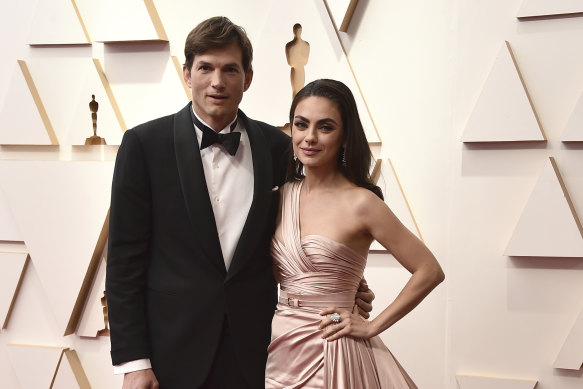 Mila Kaunis, right, with Ashton Kutcher at this year’s Oscars.