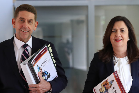 Treasurer Cameron Dick and Premier Annastacia Palaszczuk arrive with the 2020-21 budget papers.