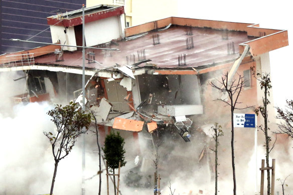 The Albanian army uses a remote-controlled explosion to demolish a building in the western port city of Durres, Albania. The quake killed 51 persons, injured more than 3000 people, and damaged more than 11,000 buildings. 