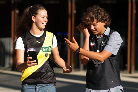Spectators with different allegiances arrive for the round one match.