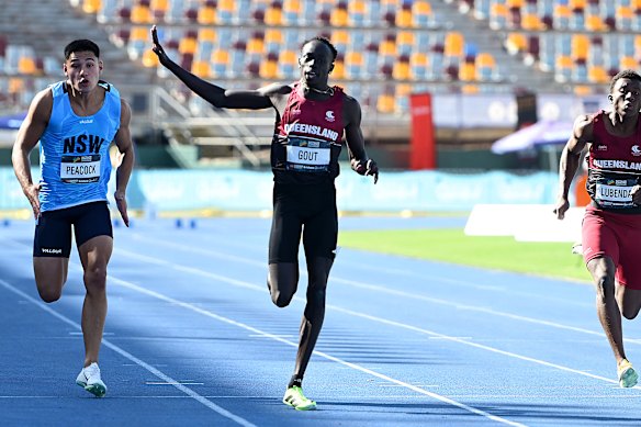 Gout Gout waves during his run in the 100 metres in the Australian Athletics junior championships.