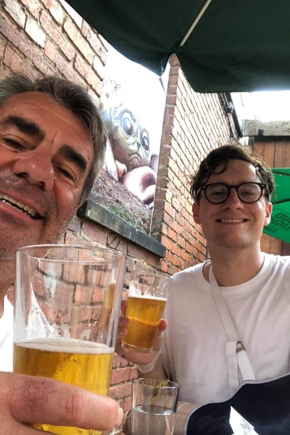 Knott sharing a beer with his father David, who flew to the US from Newcastle, NSW, to be with his son after the accident. 
