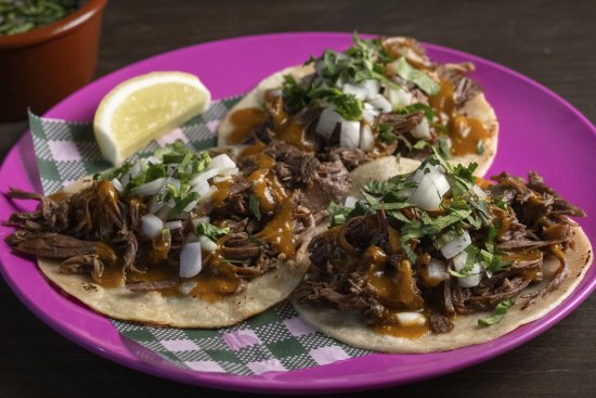 Barbacoa estilo Hidalgo (lamb barbacoa tacos with chilli consommé).