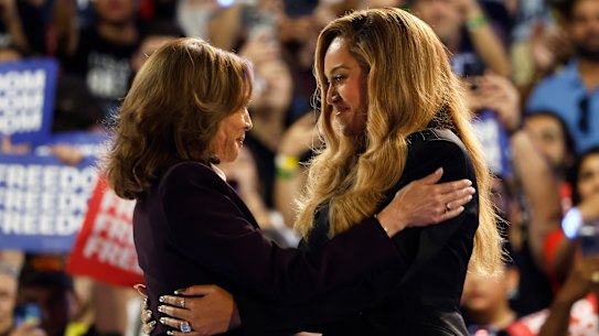 Musical artist Beyonce, right, and Democratic presidential nominee Vice President Kamala Harris, left, embrace on stage during a campaign rally Friday, Oct. 25, 2024, in Houston.