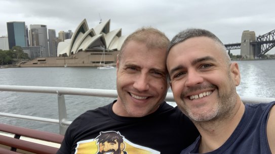 Shawn Rawleigh (left) finally has a travel exemption, allowing him to be reunited with his partner Ben Scrivener.