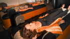 Clients are immersed in light, sound and vibrations while lying on high-tech waterbeds.