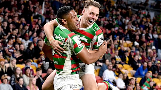 Rabbitohs winger Taane Milne (left) celebrates a try with Blake Taaffe.