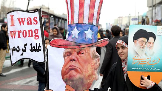 An Iranian woman holds an effigy of US President Donald Trump during a rally earlier this year.