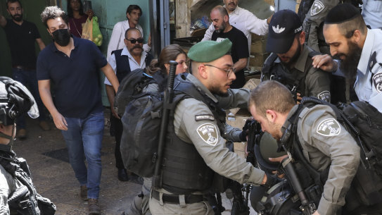 Israeli police officers detain a Palestinian youth during a protest against Israel’s air strikes on the Gaza Strip and the violent confrontations between Israeli security forces and Palestinians, in Jerusalem’s Old City on Tuesday.