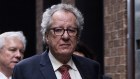 Geoffrey Rush and his wife Jane Menelaus leave the Federal Court in Sydney after winning the defamation trial in April last year.