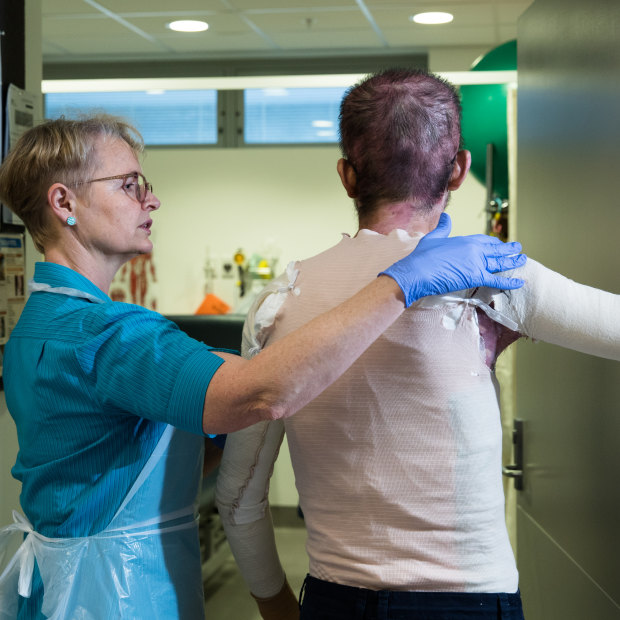 Senior physiotherapist Julie Bricknell with a patient in the Royal North Shore Hospital Burns Unit.