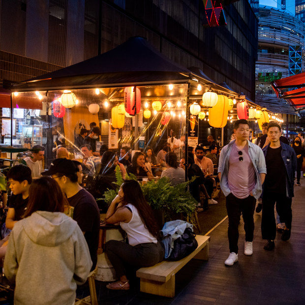 Diners outside Nakano Darling on Steam Mill Lane in the thriving Darling Square area.