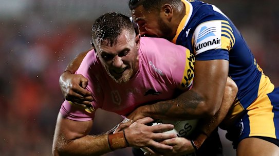 Kurt Capewell of the Panthers is tackled by Waqa Blake of the Eels during the NRL Trial Match between the Penrith Panthers and the Parramatta Eels at Panthers Stadium.