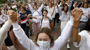 About 200 women march in solidarity with protesters injured in the latest rallies against the results of the country's presidential election in Minsk, Belarus.