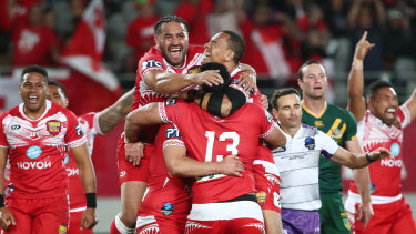 Tonga celebrate their breakthrough win over Australia at Eden Park.