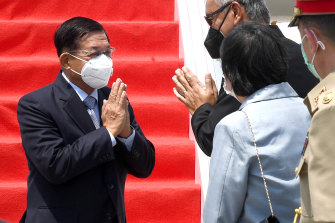 Myanmar’s Senior General Min Aung Hlaing is greeted by Indonesian officials upon arrival at Soekarno-Hatta International Airport on the outskirts of Jakarta on Saturday.