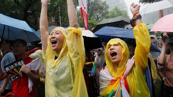 Same-sex marriage supporters cheer outside the Legislative Yuan in Taipei, Taiwan, on Friday.