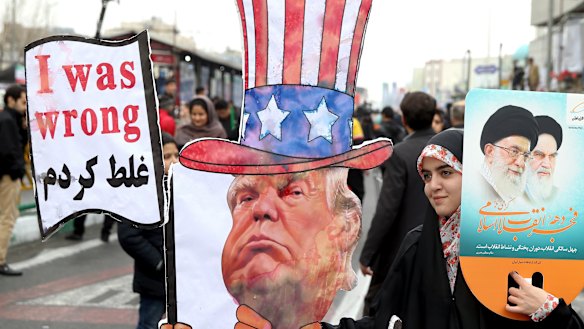 An Iranian woman holds an effigy of US President Donald Trump during a rally earlier this year.