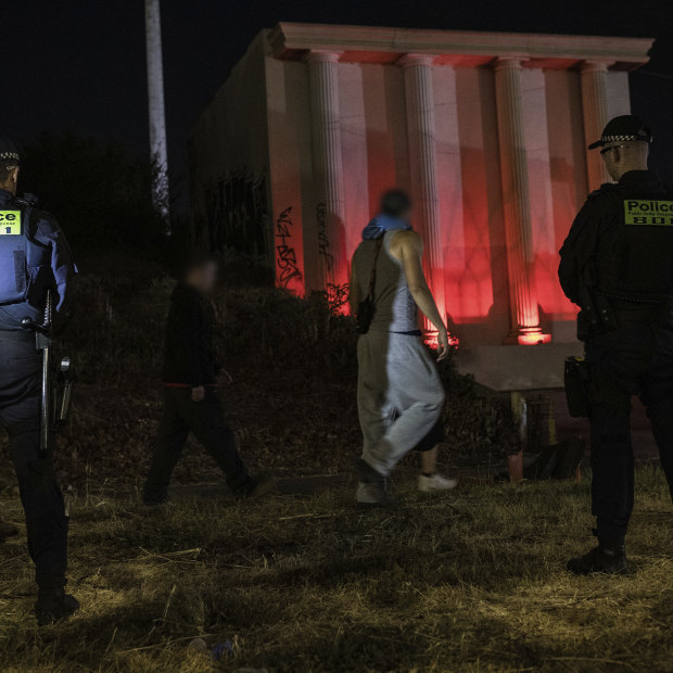 Police gather outside a rave.