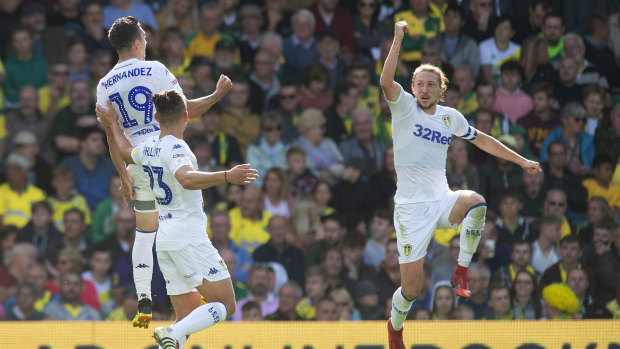 On-song: Leeds United's Pablo Hernandez (top left) celebrates scoring his side's third goal against Norwich.