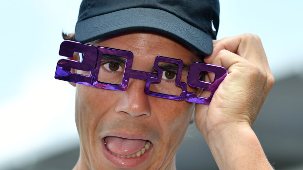 Hamming it up: Rafael Nadal wears some 2019 novelty glasses to celebrate the new year on day one of the Brisbane International.