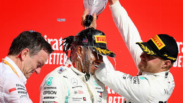 Teammate and race winner Valtteri Bottas (right) on the podium with Lewis Hamilton.