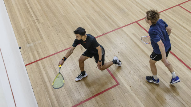 Malaysia's Addeen Idrakie takes on Australia's Rex Hedrick in the Squash ACT Open final on Sunday. 