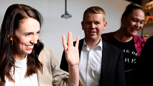 Jacinda Ardern waves to supporters at an Auckland cafe on Sunday morning, after her election victory.