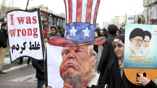An Iranian woman holds an effigy of US President Donald Trump during a rally earlier this year.