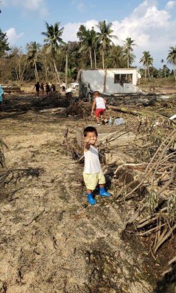 Children can be seen in the debris in Nuku’alofa. 