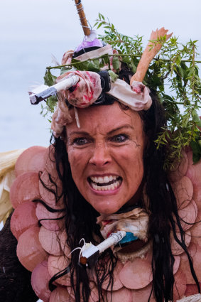 Actress Jo Bloom performs the character Caliban in The Tempest on Sydney Harbour. 